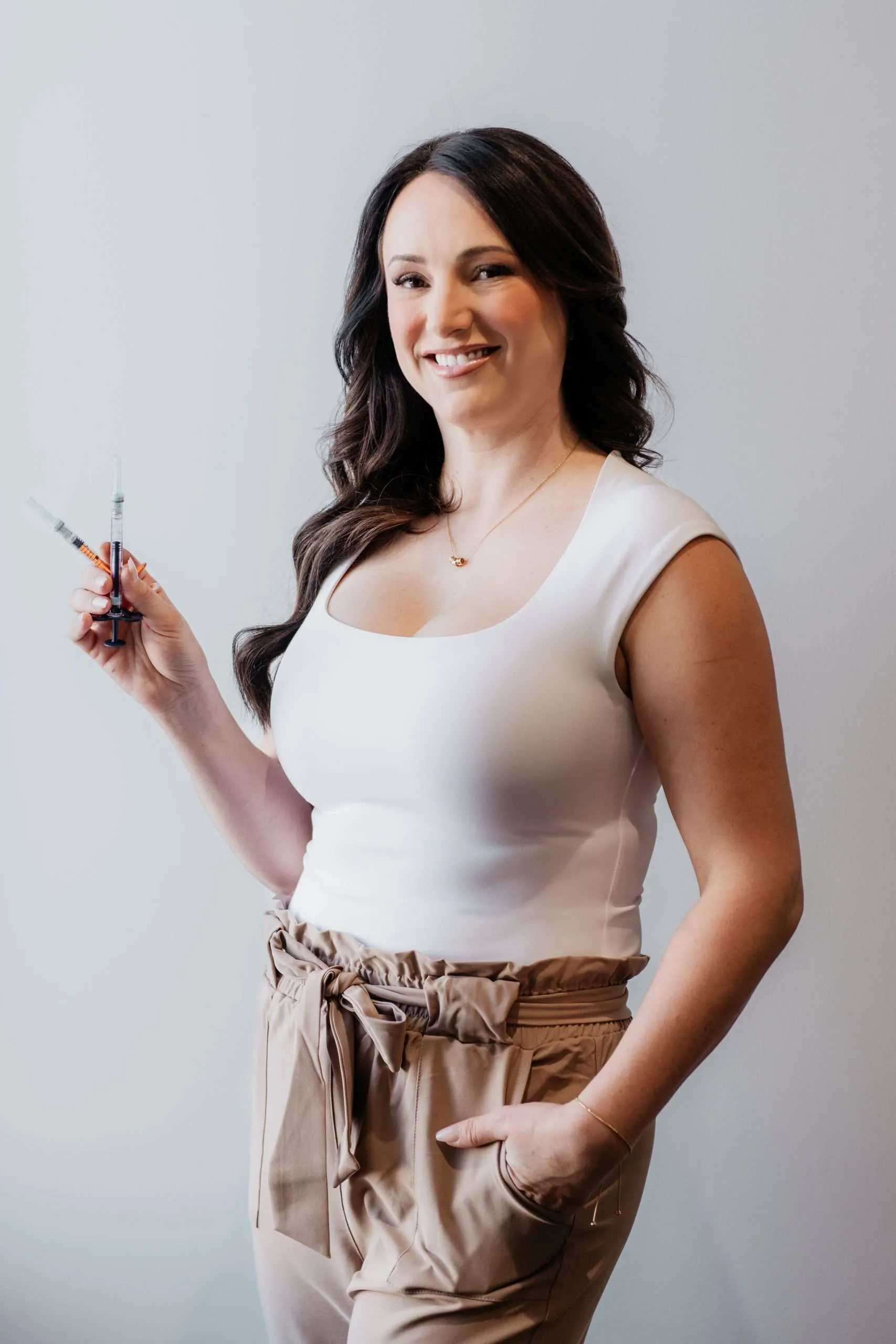 Urbane Beauty injector holding fine-gauge syringes